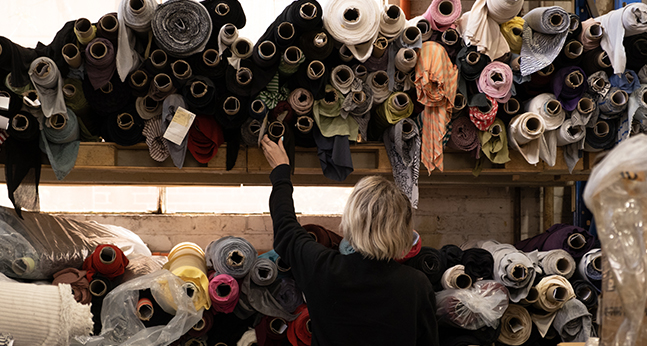 Woman is looking at Australian surplus fabrics stocks