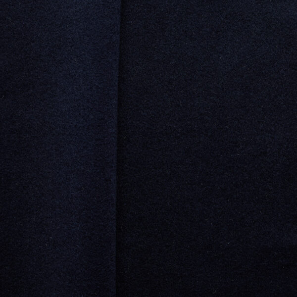 Navy brushed wool coating fabric, flat lay showing dense weave and soft surface texture