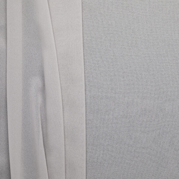 Grey poly chiffon fabric, flat lay showing soft drape and sheer quality